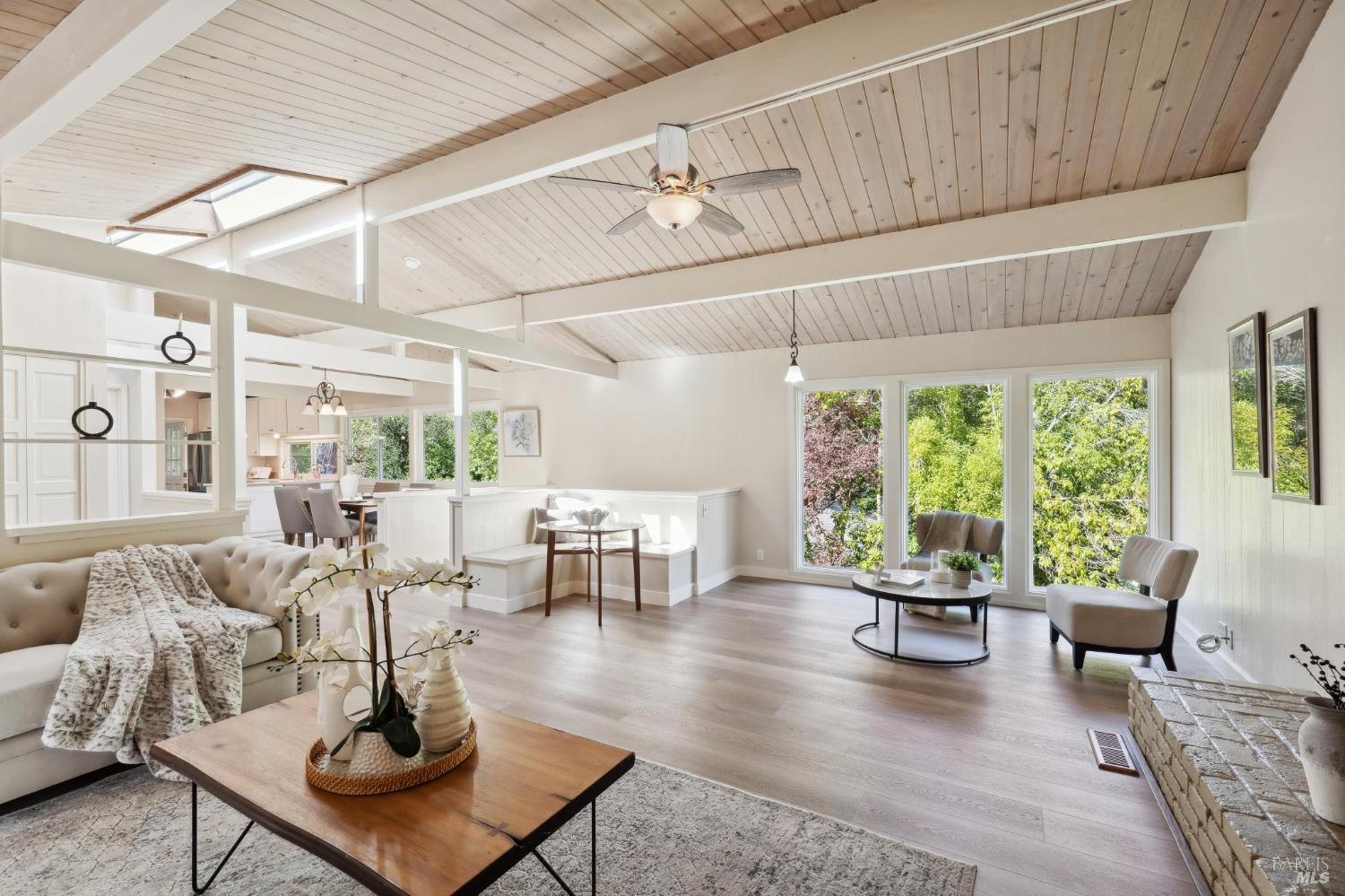 Step into this inviting, sunlight-filled living space with its high ceilings and alluring flooring.