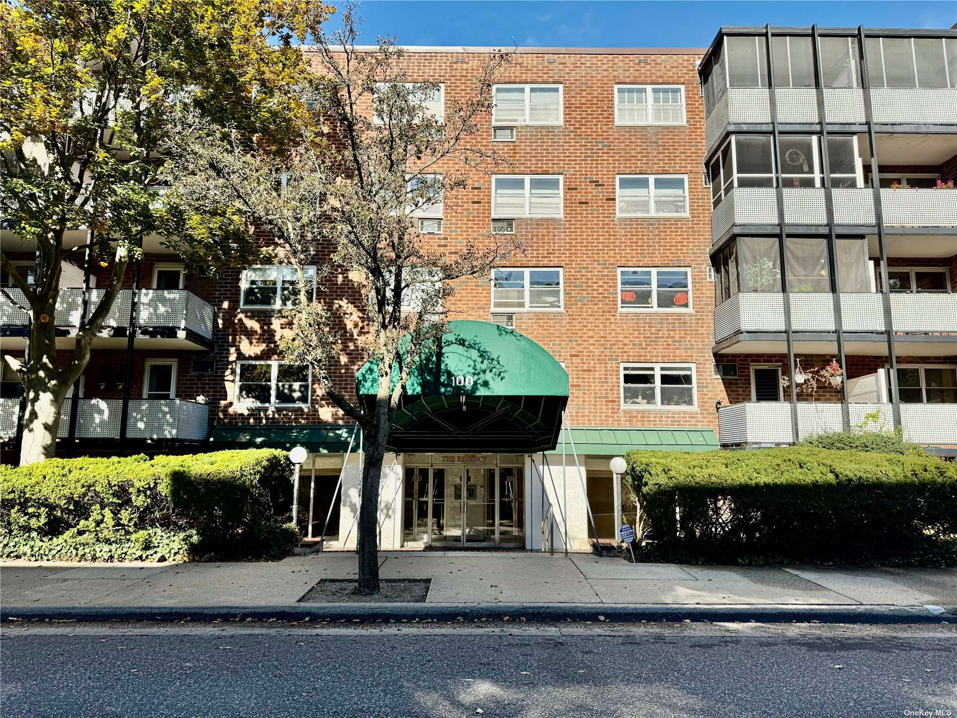 a front view of a building with garden