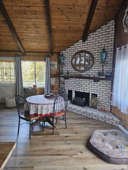 a dining room with furniture window and wooden floor