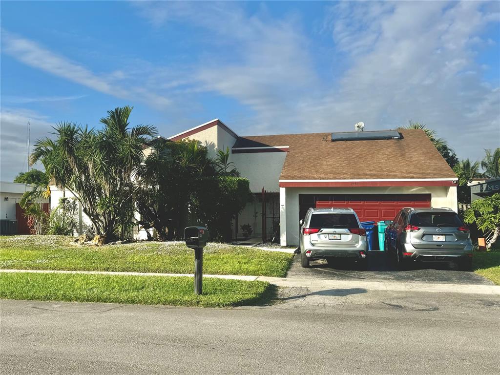 front view of a house with a street