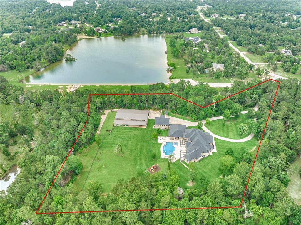 8+ acres fully fenced with foliage for privacy.