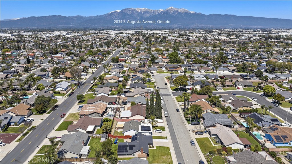 an aerial view of residential house and mountain view