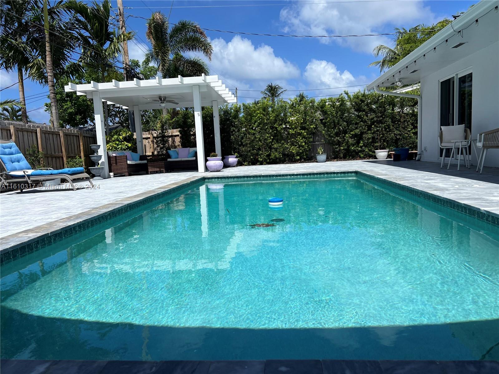 a view of a swimming pool with a patio