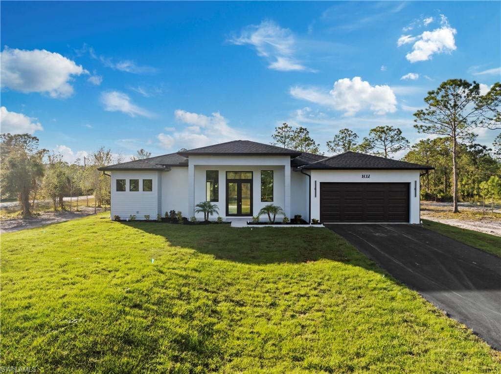 front view of a house with a yard