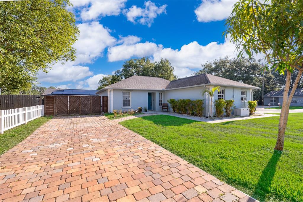 a view of a house with a yard