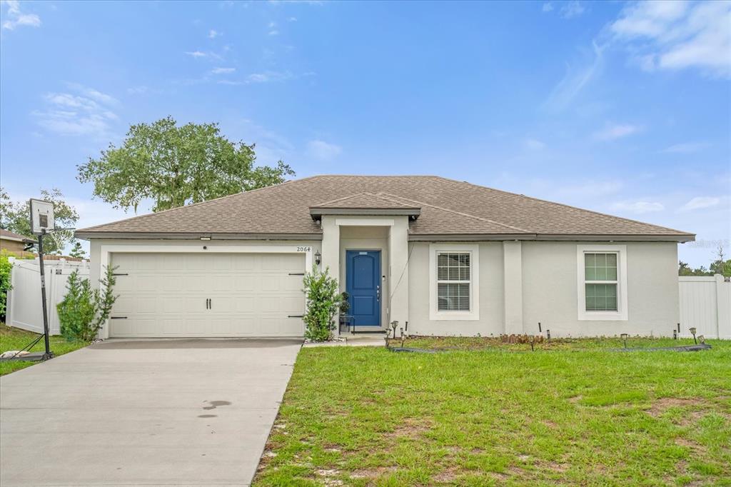 front view of a house with a yard