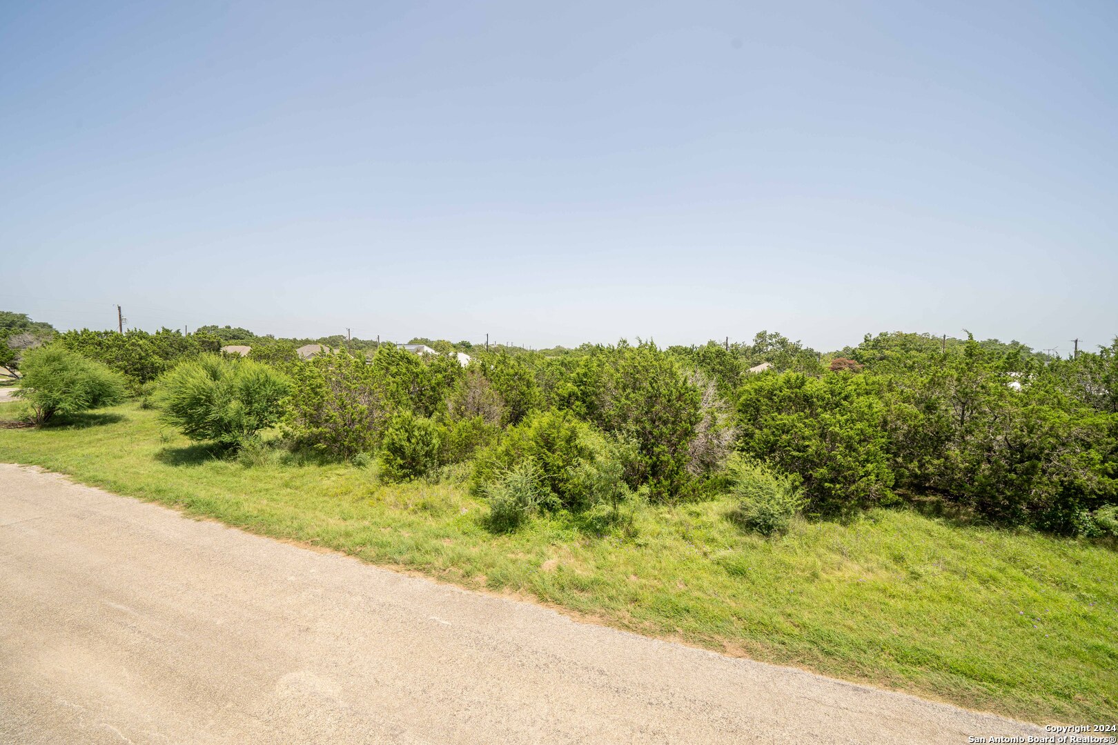 a view of a road with a yard