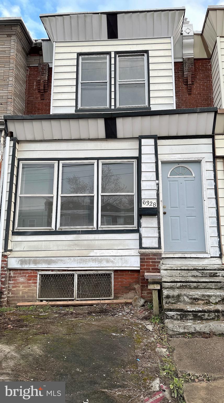 a view of house with wooden door