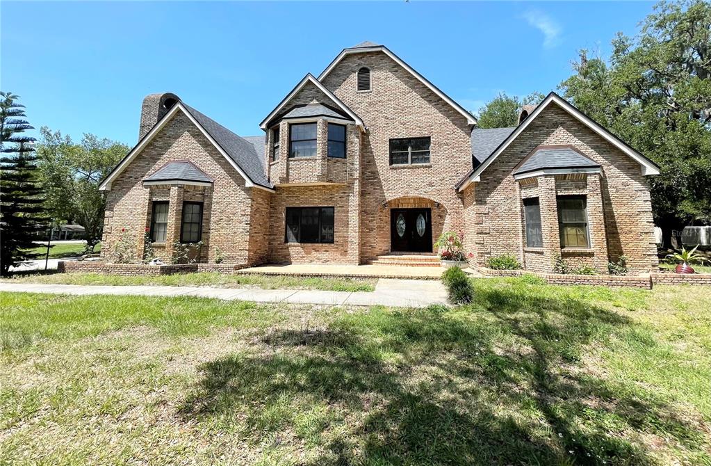 a front view of a house with yard