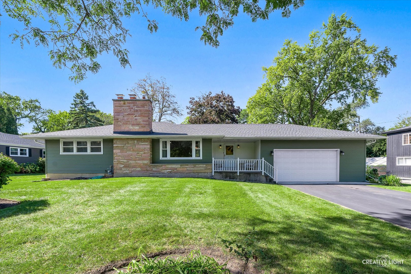 front view of a house with a yard