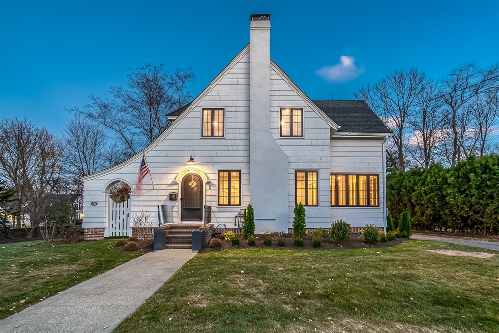 a front view of a house with a yard