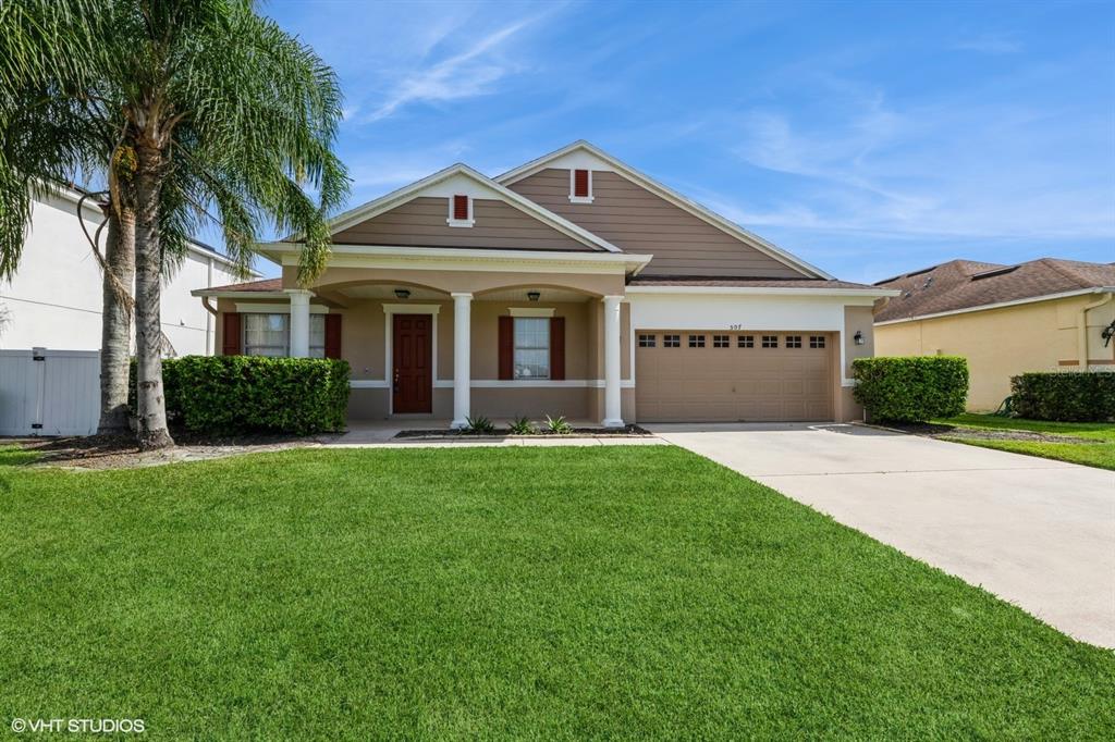 a front view of a house with a yard