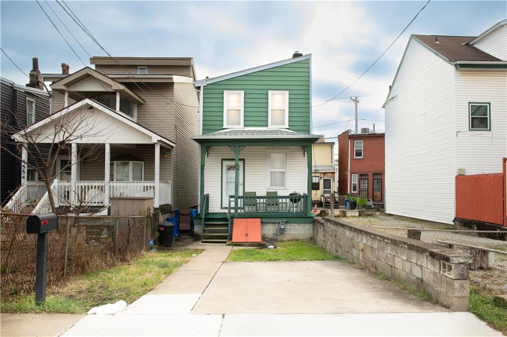 a front view of a house with porch