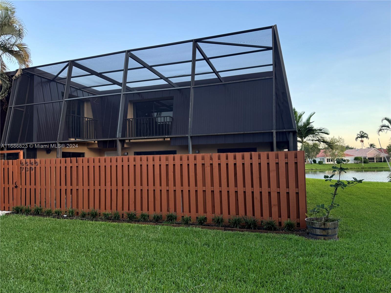 a front view of a house having yard