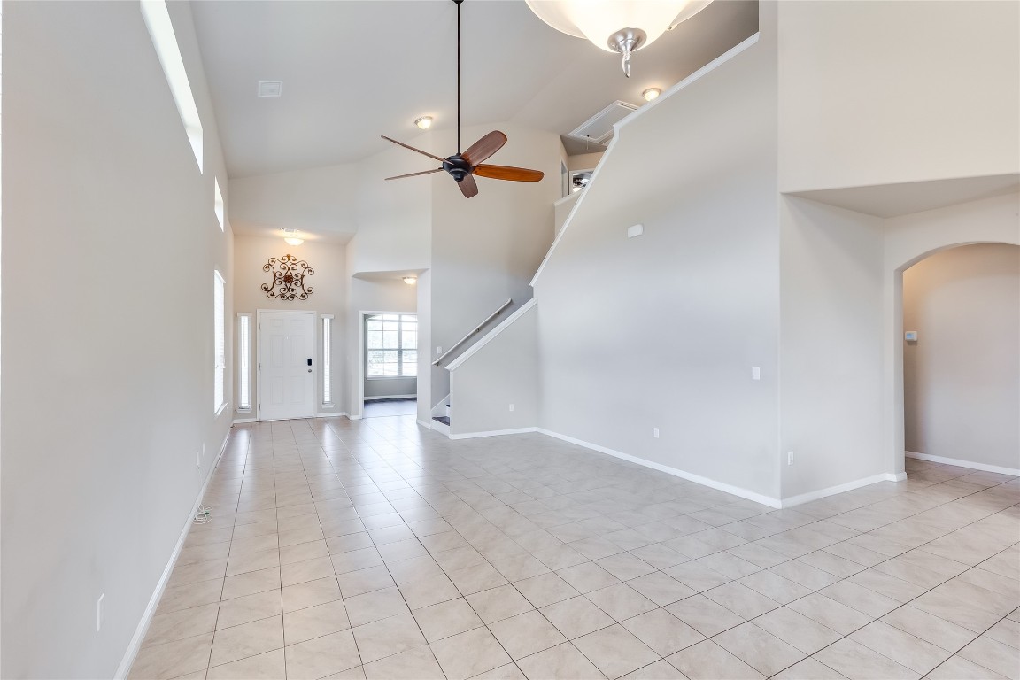 a view of a livingroom with a ceiling fan and window