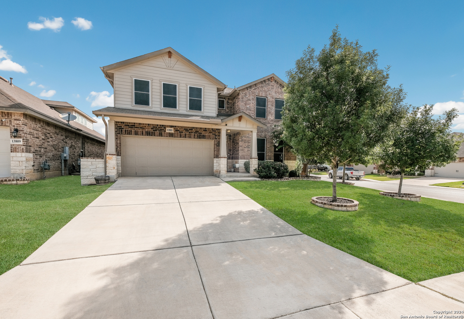 a front view of a house with yard