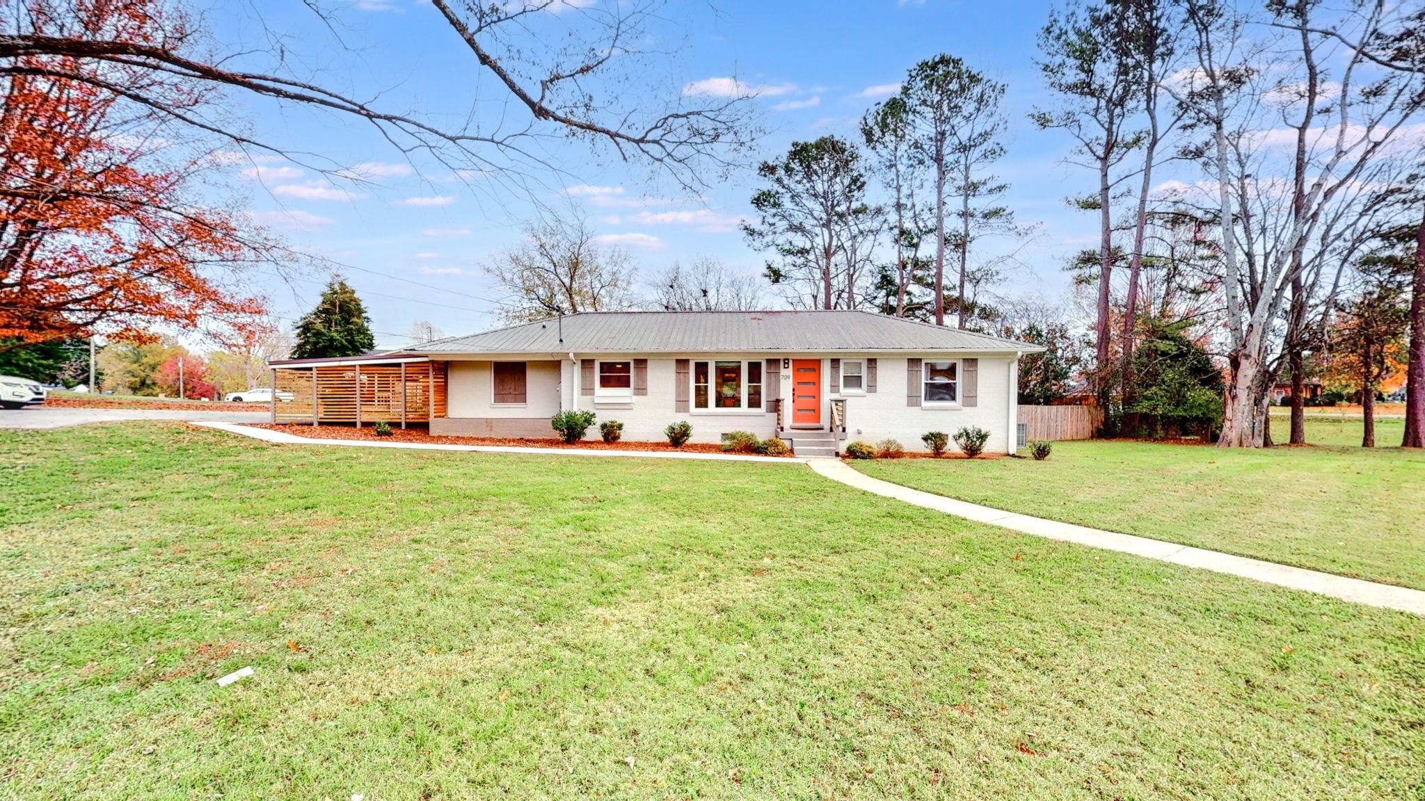 front view of a house with a big yard