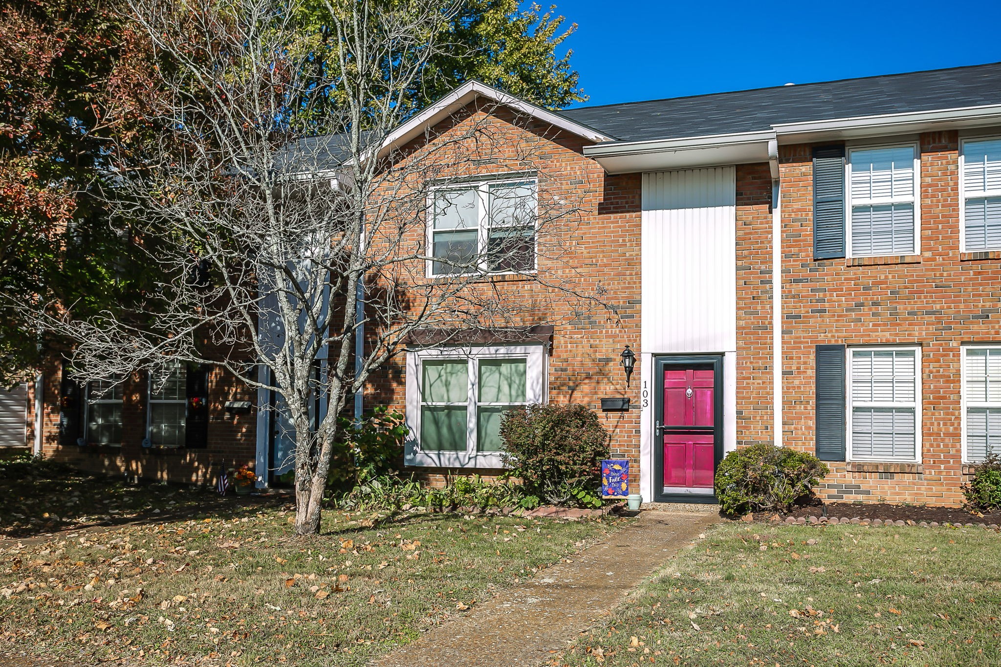 a front view of a house with a yard