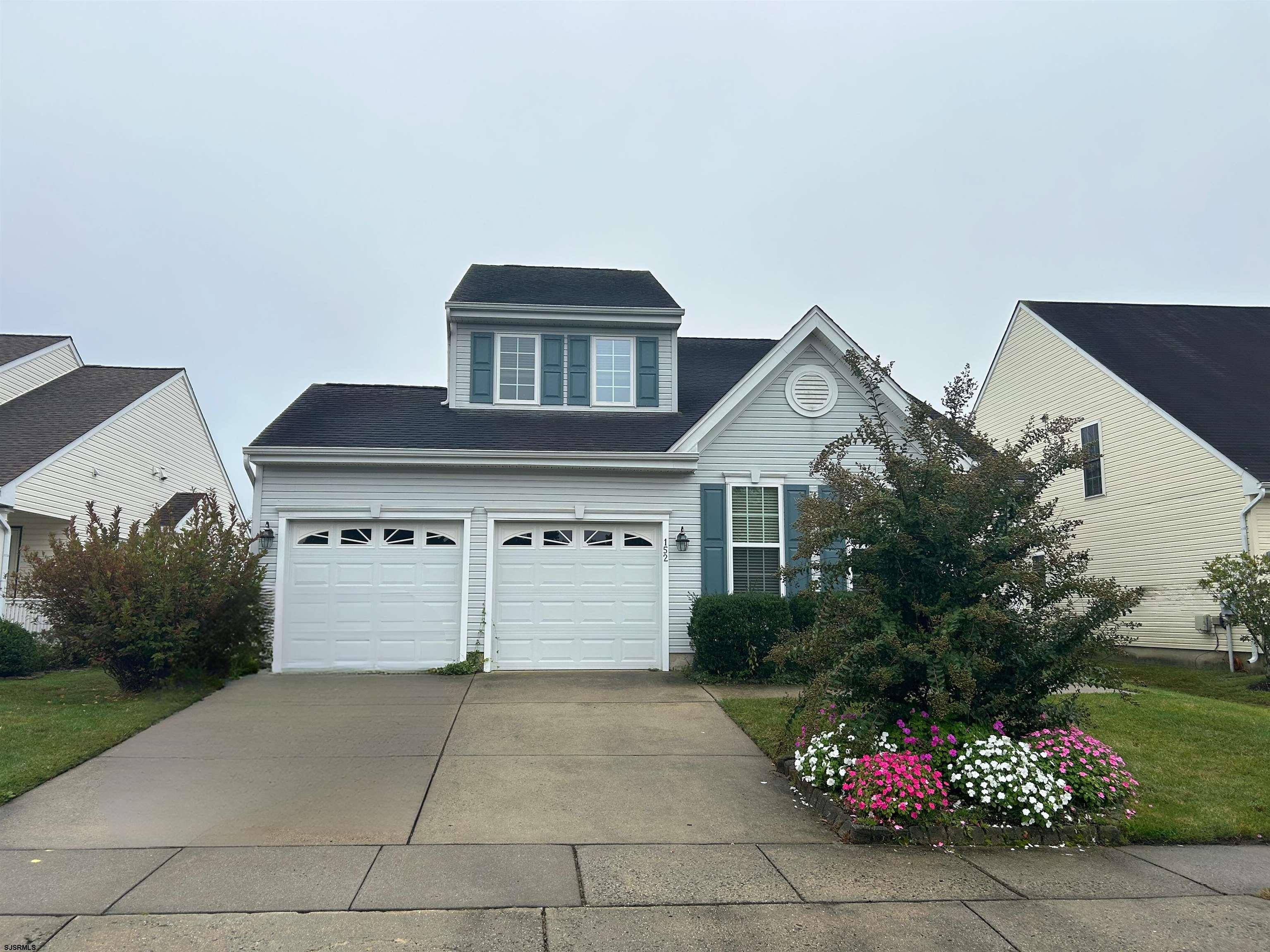 a front view of a house with a garage