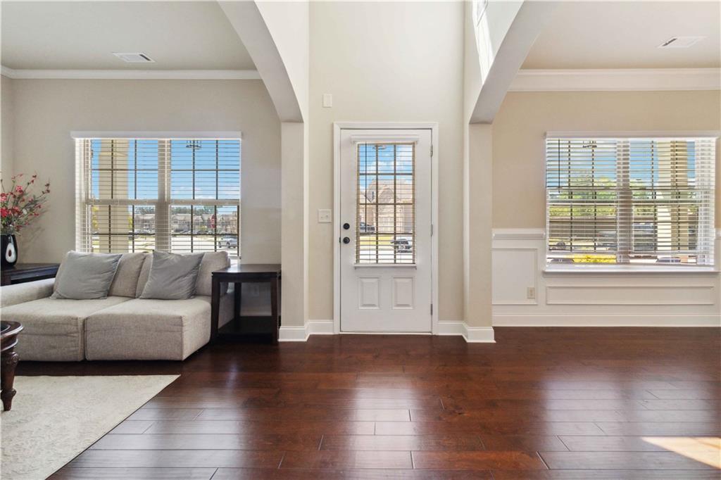 a living room with furniture and windows