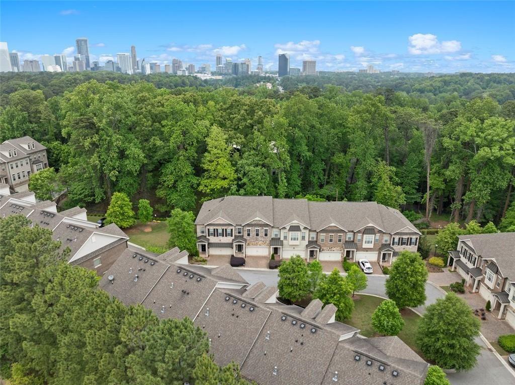 an aerial view of a house with yard and mountain view