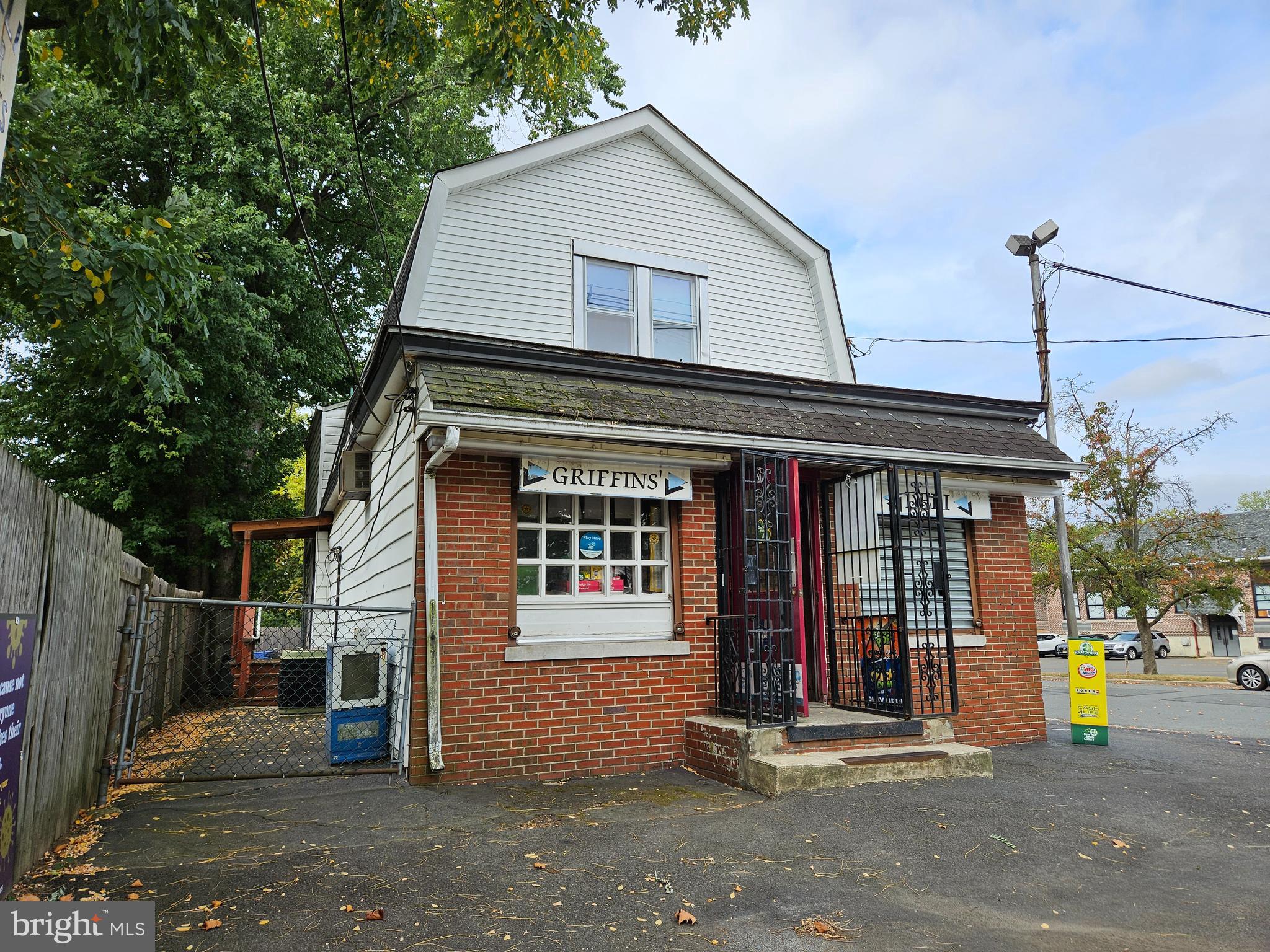 a front view of a house with basket ball court and a garage