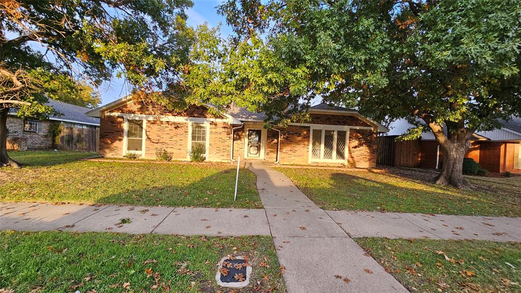 front view of a house with a yard