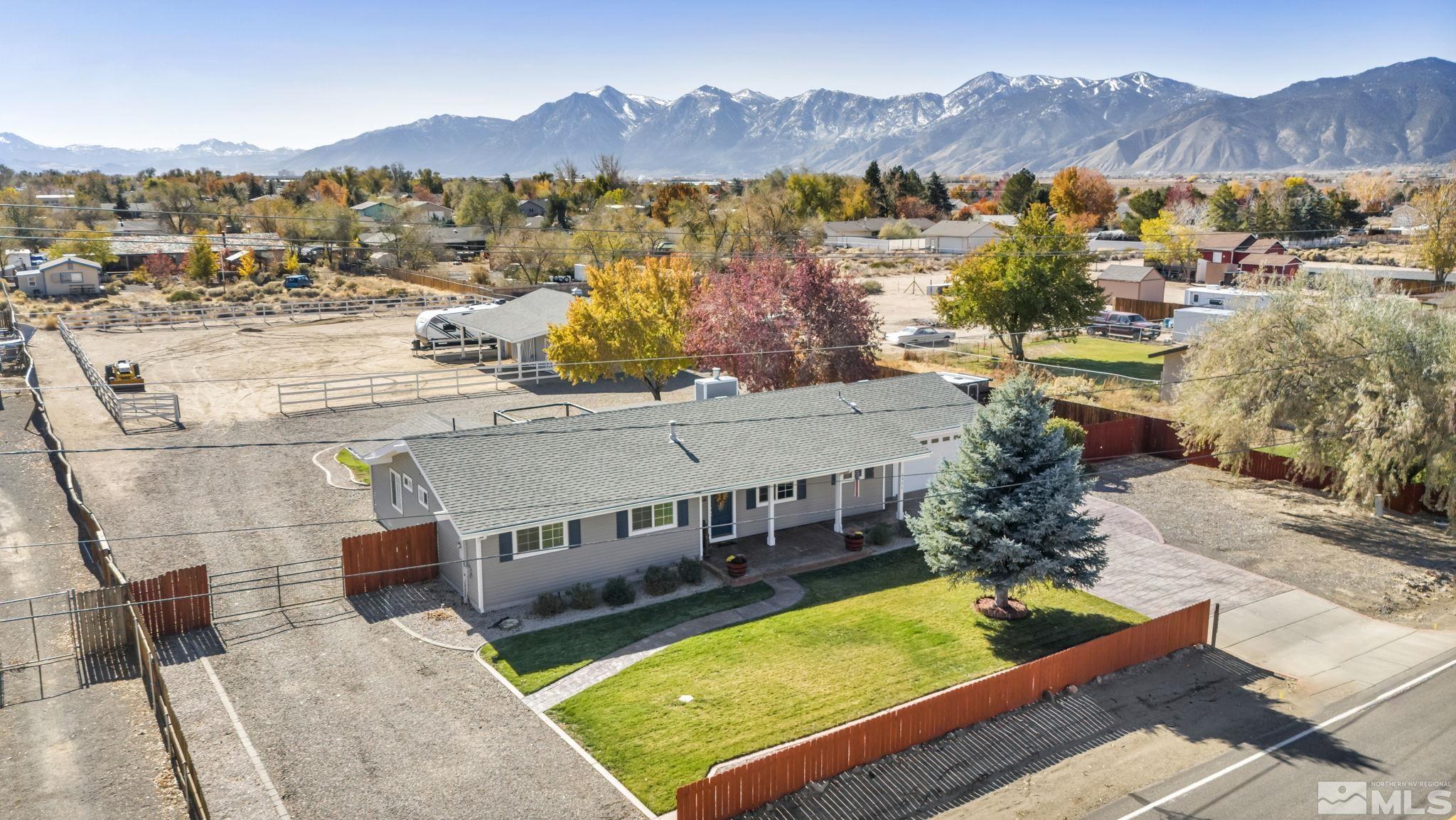 an aerial view of a house with a swimming pool