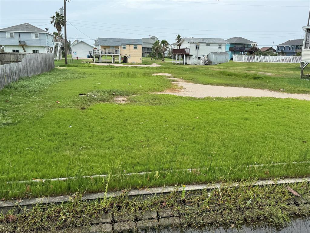 a view of a grassy field with sitting area