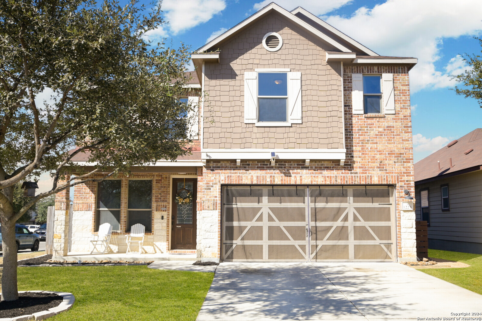 a front view of a house with a yard