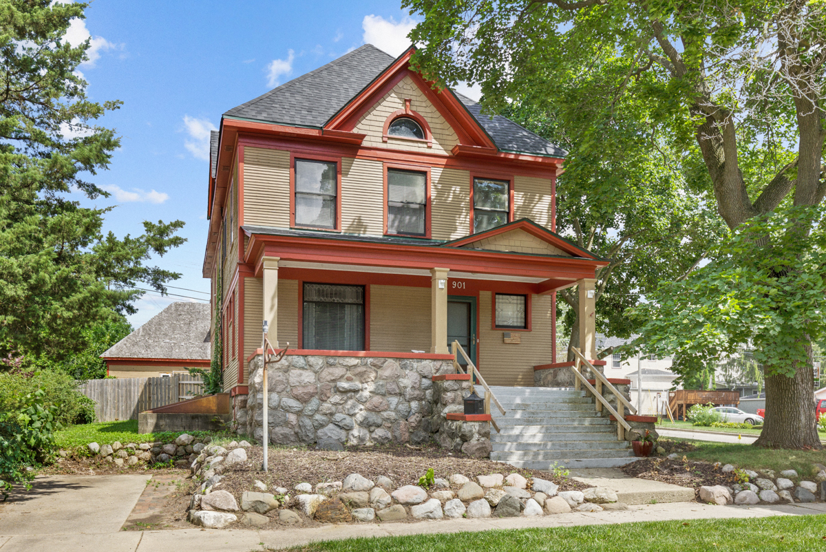 a front view of a house with garden