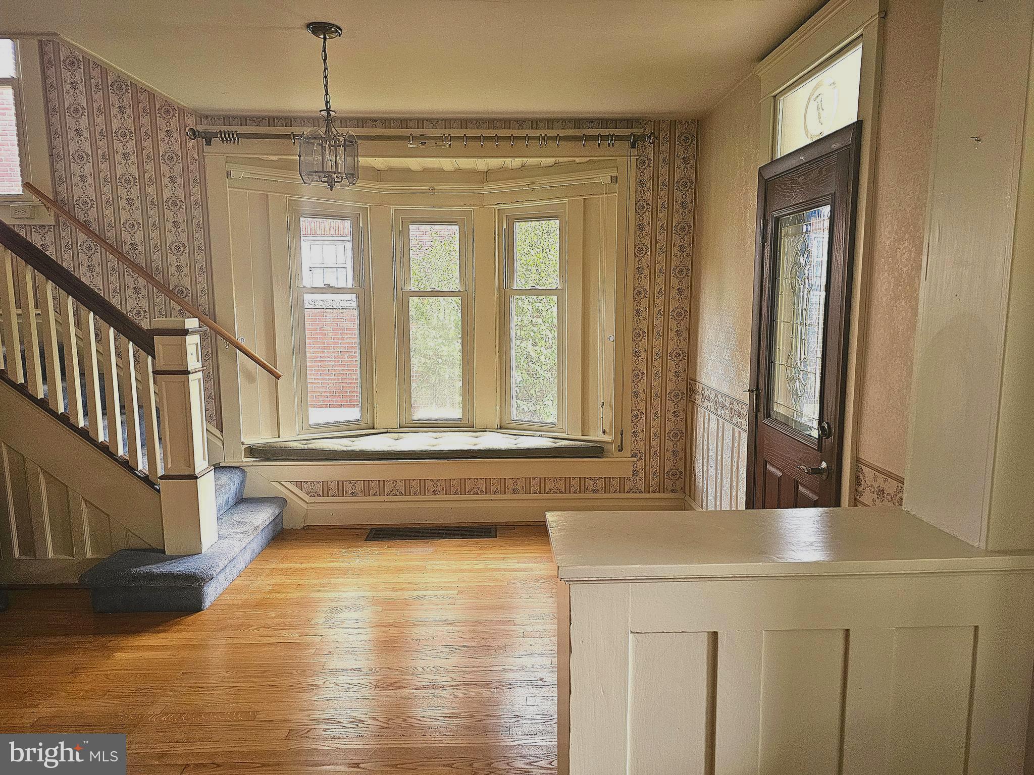 a bathroom with a tub a sink and a window