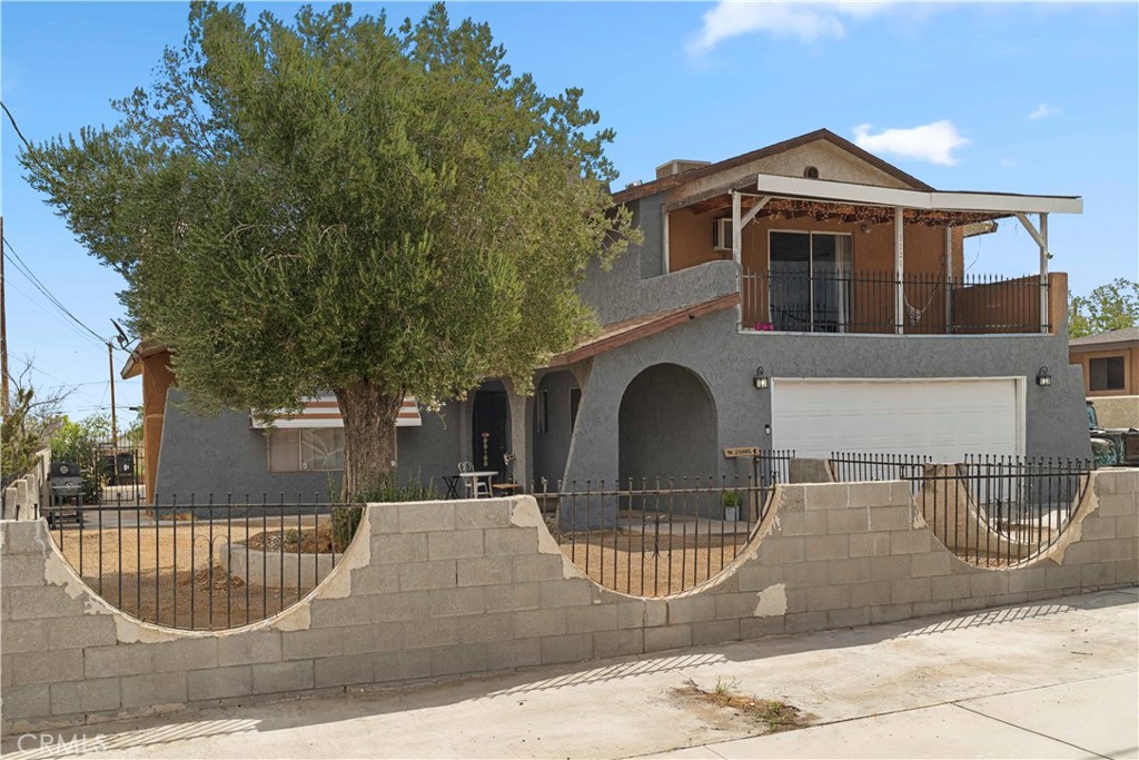 a front view of a house with garage