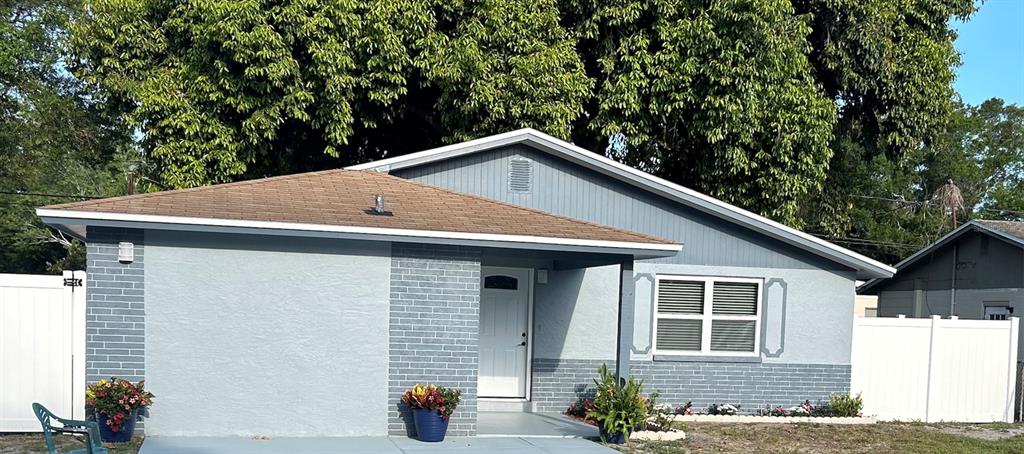 a house with trees in the background