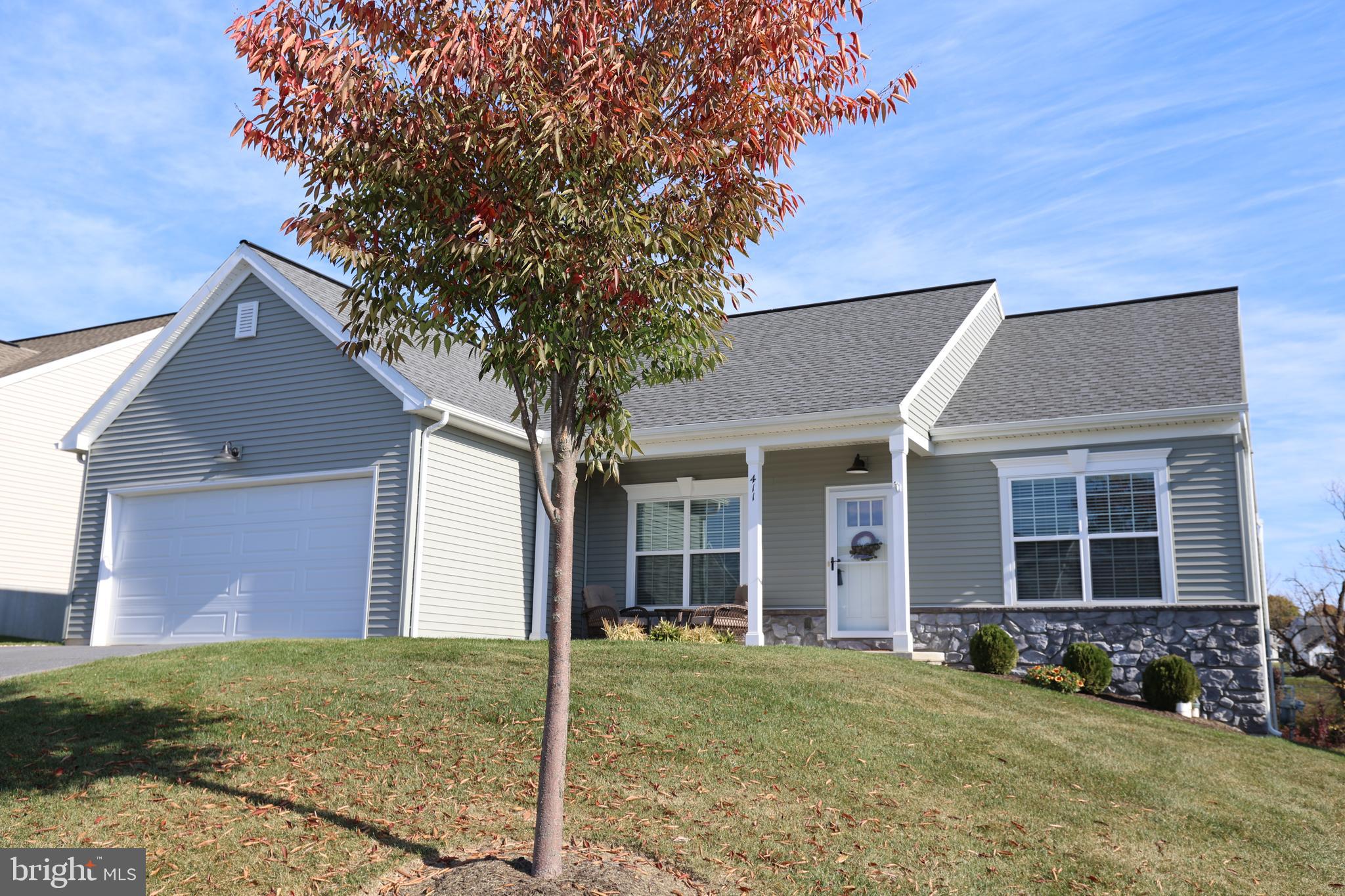 front view of a house with a yard