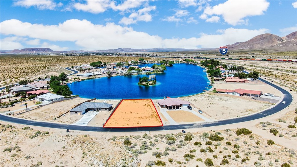 swimming pool view with a lake view