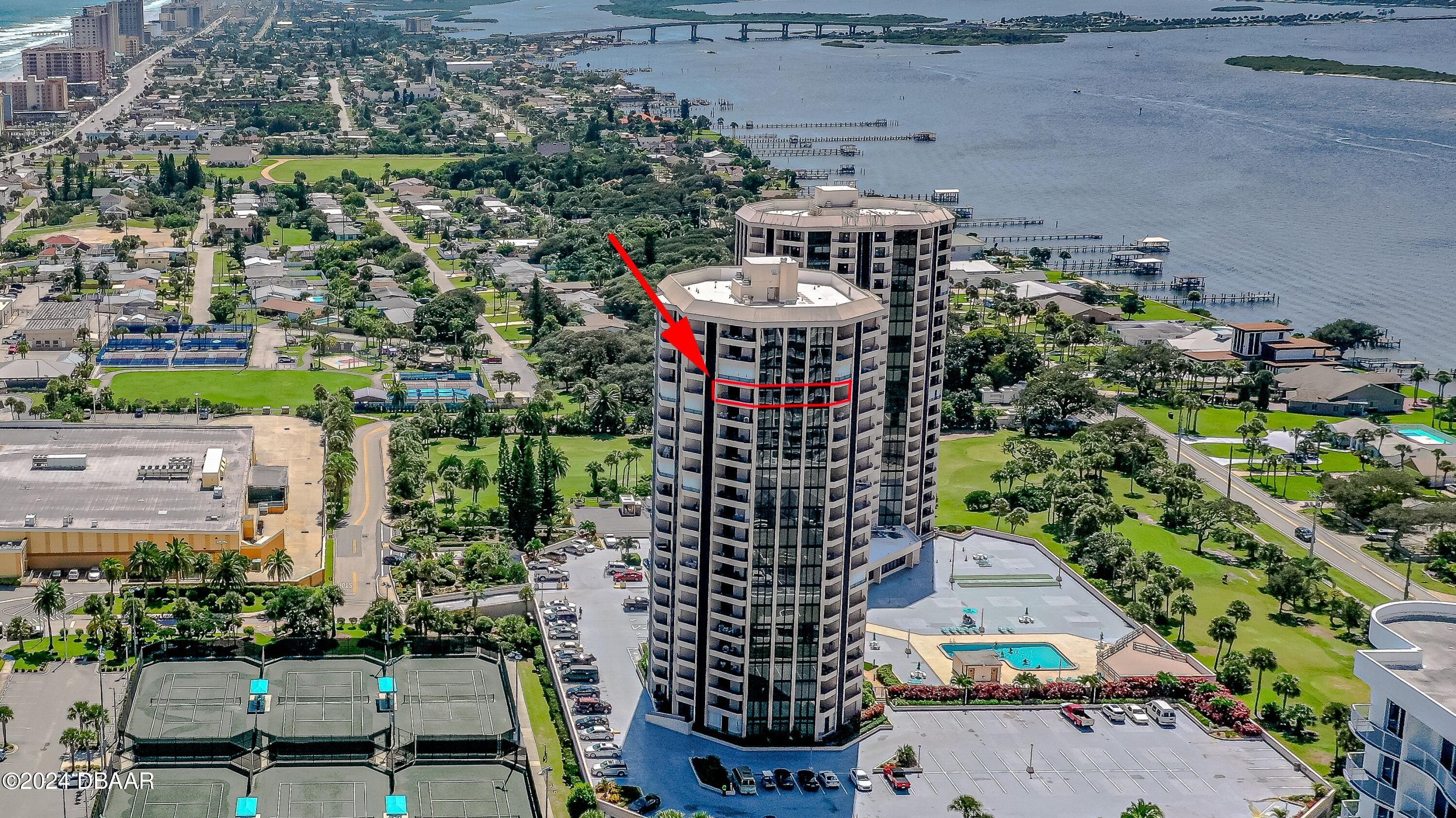 an aerial view of a houses with yard