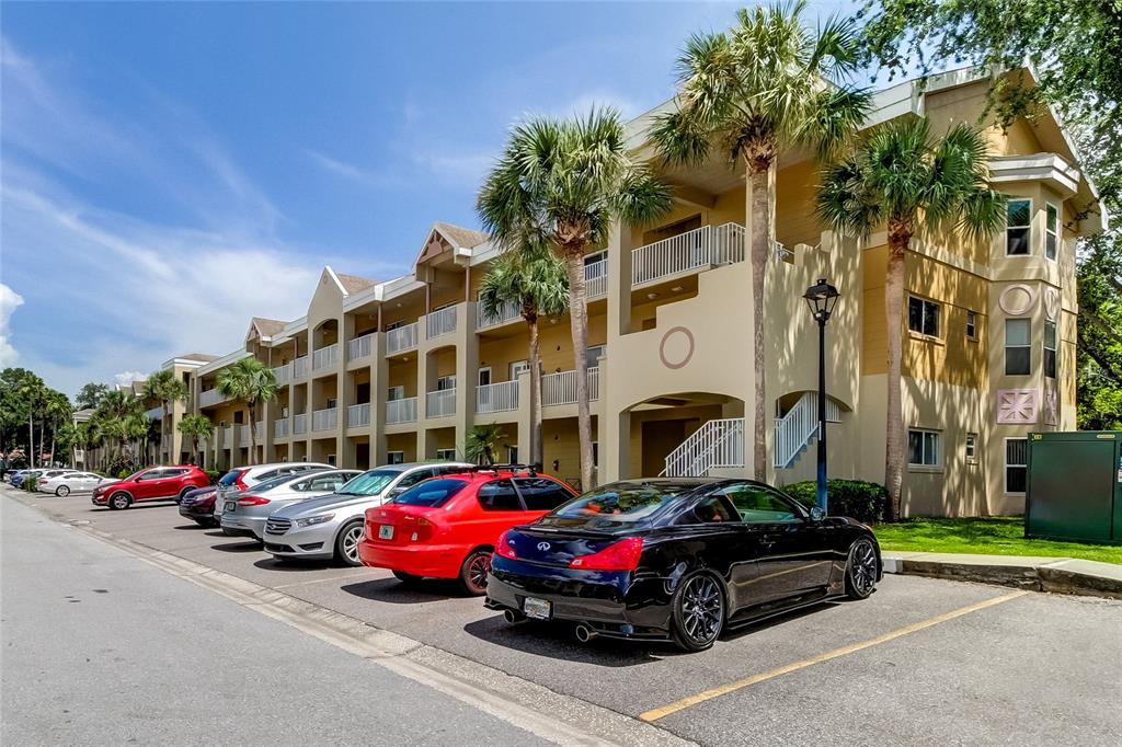 a view of cars parked in front of a building