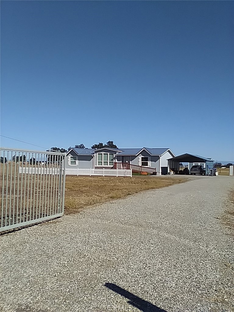 a view of street with wooden fence