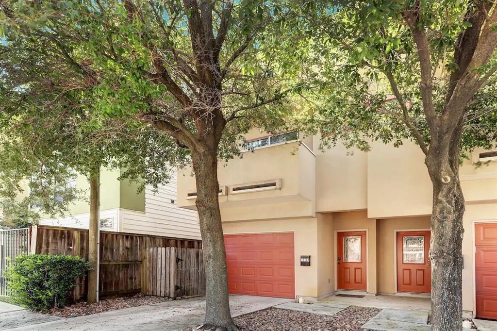 a front view of a house with tree s