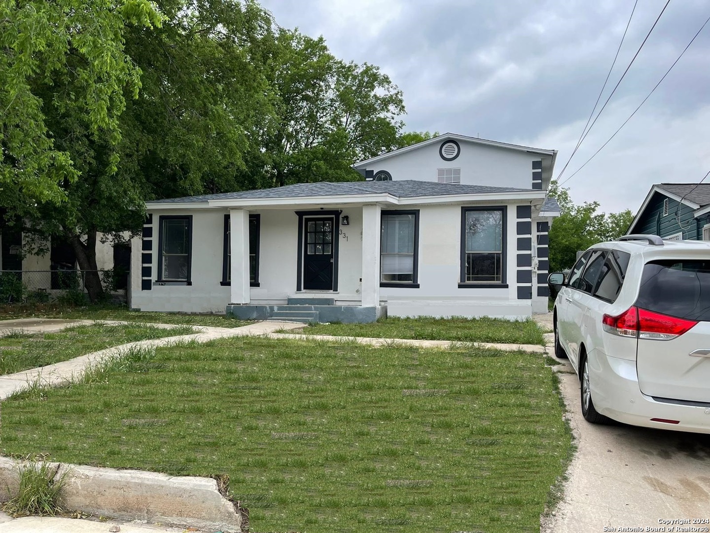 a front view of a house with garden