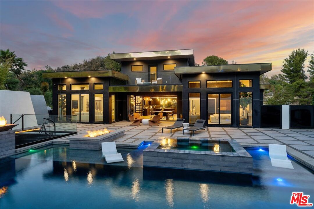 a view of a house with pool table and chairs