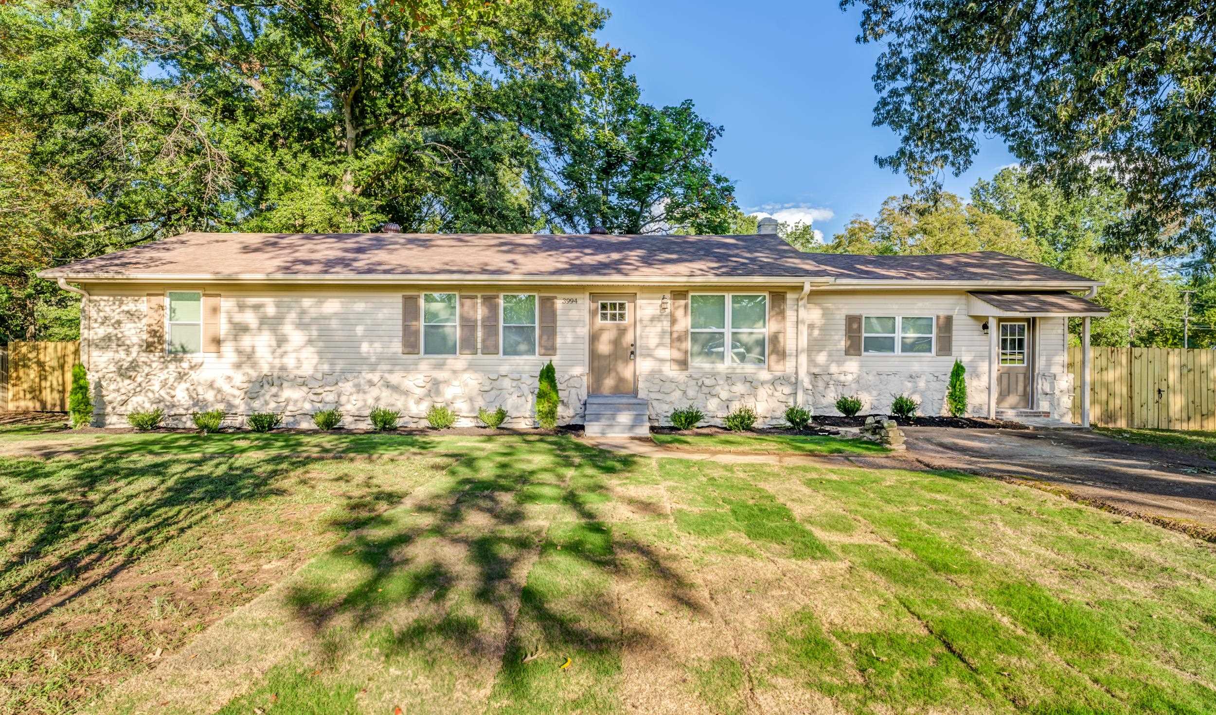 Ranch-style home with a front yard