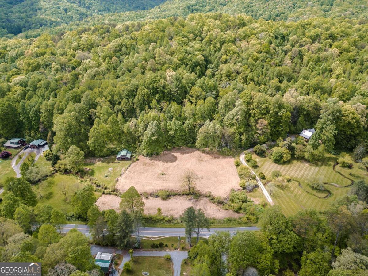 a view of a lake with a yard