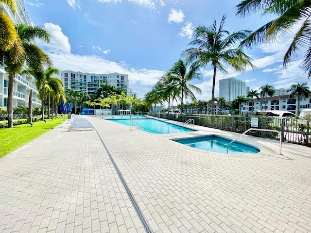 a view of a backyard and swimming pool