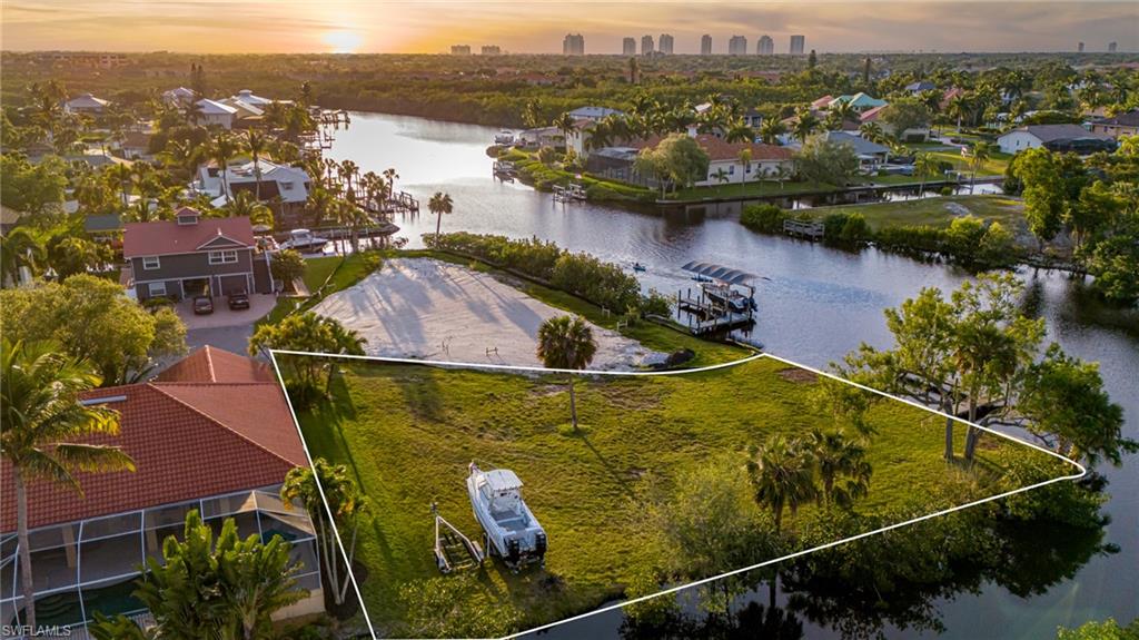 an aerial view of a house with a lake view