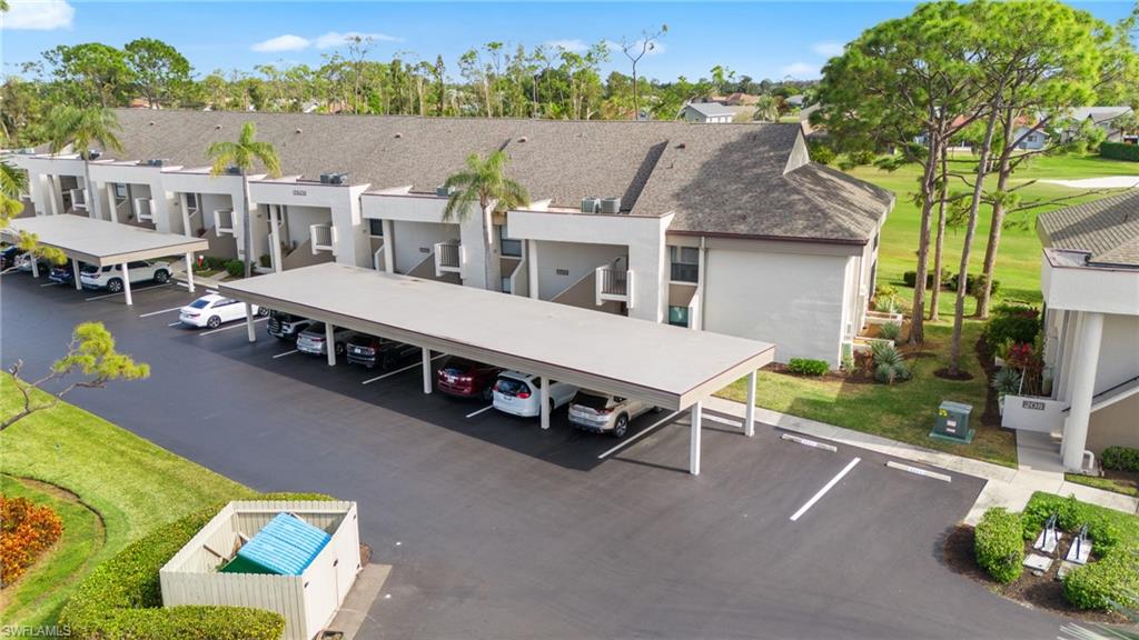 an aerial view of a house with swimming pool and patio