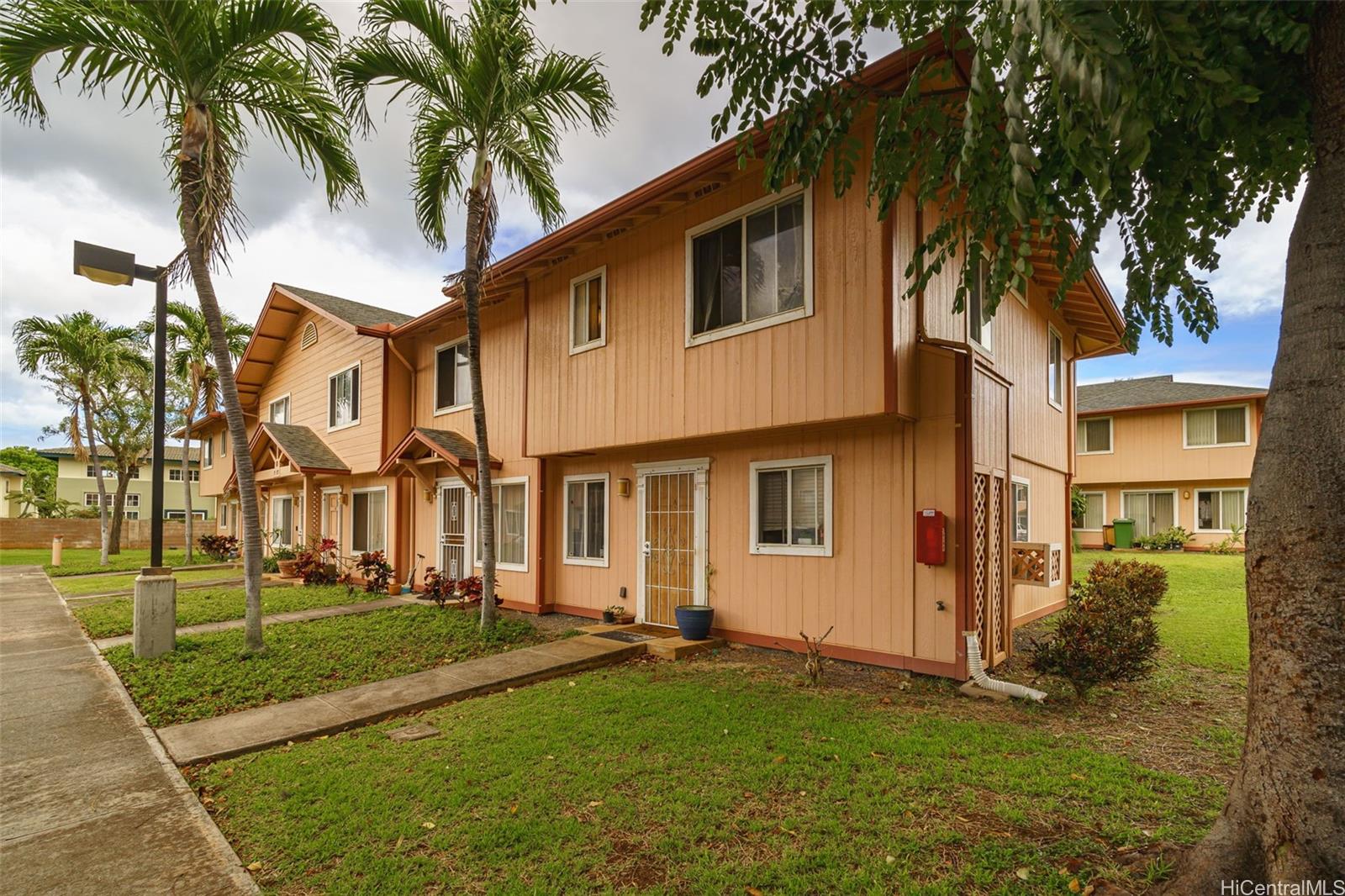 a view of a yard in front of a house