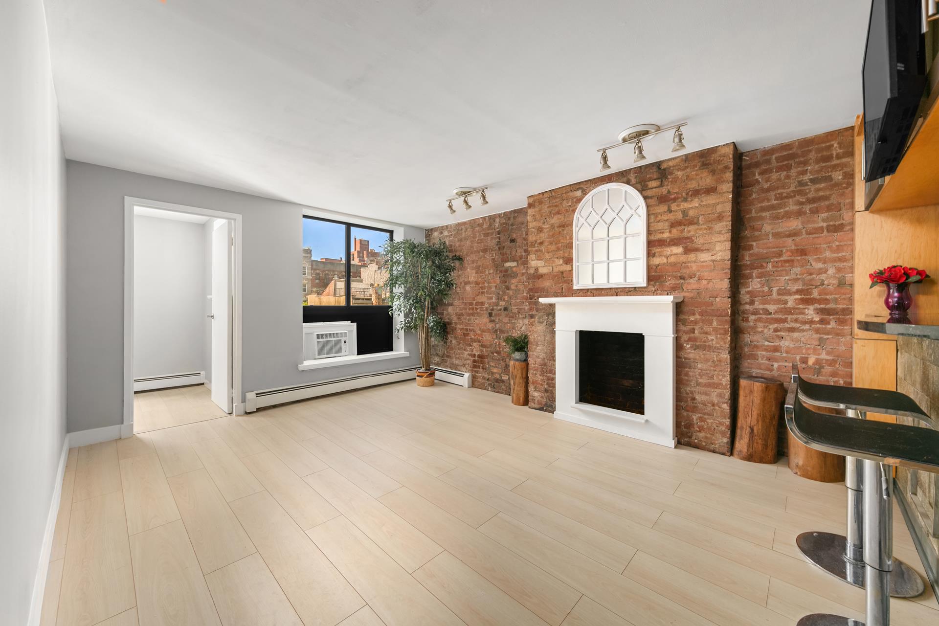 a view of a livingroom with a fireplace