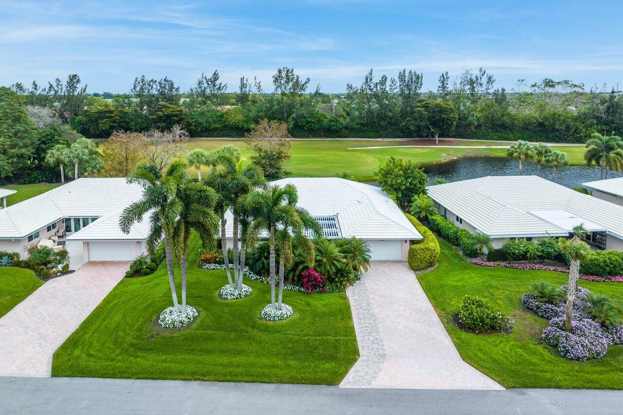 an aerial view of a house with outdoor space tennis court